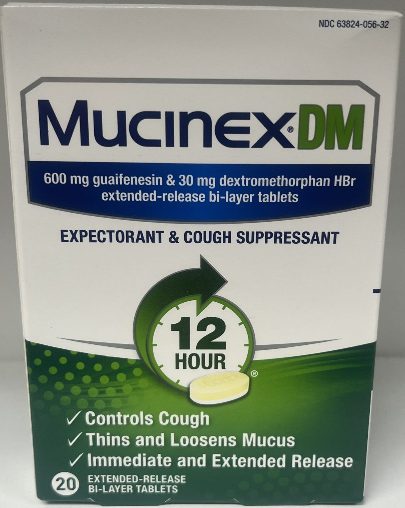 The front of a Mucinex DM package highlights 12-hour relief for cough and mucus with extended-release bi-layer tablets.