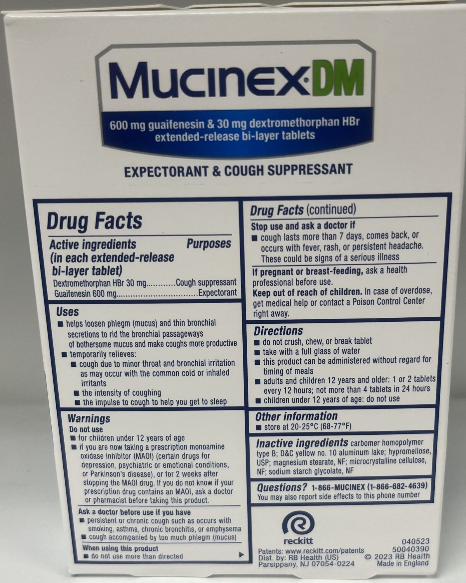 The back of a Mucinex DM package lists active ingredients, uses, directions, warnings, and customer support information for safe usage.