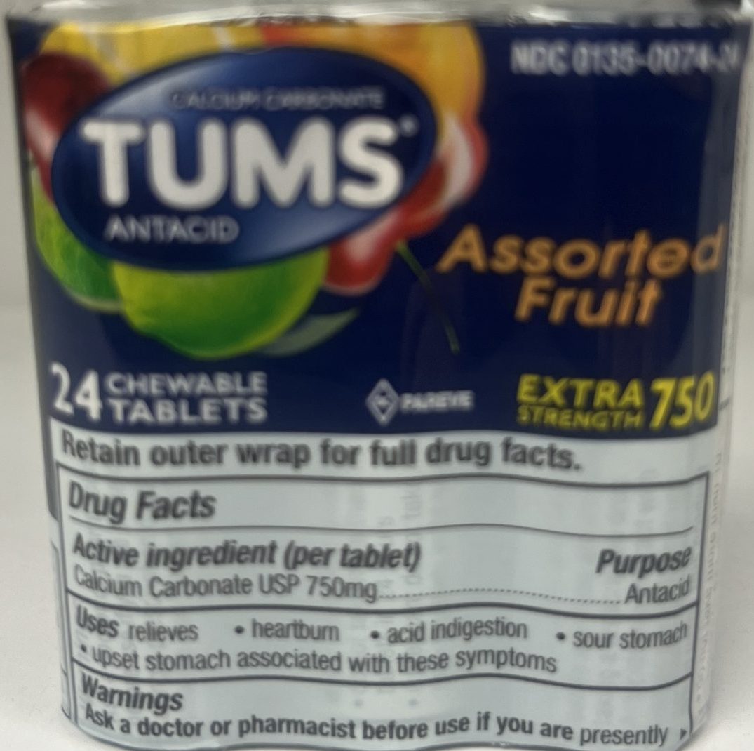 The front of a Tums Assorted Fruit package highlights it as an antacid with 24 chewable tablets for relief from heartburn and indigestion.