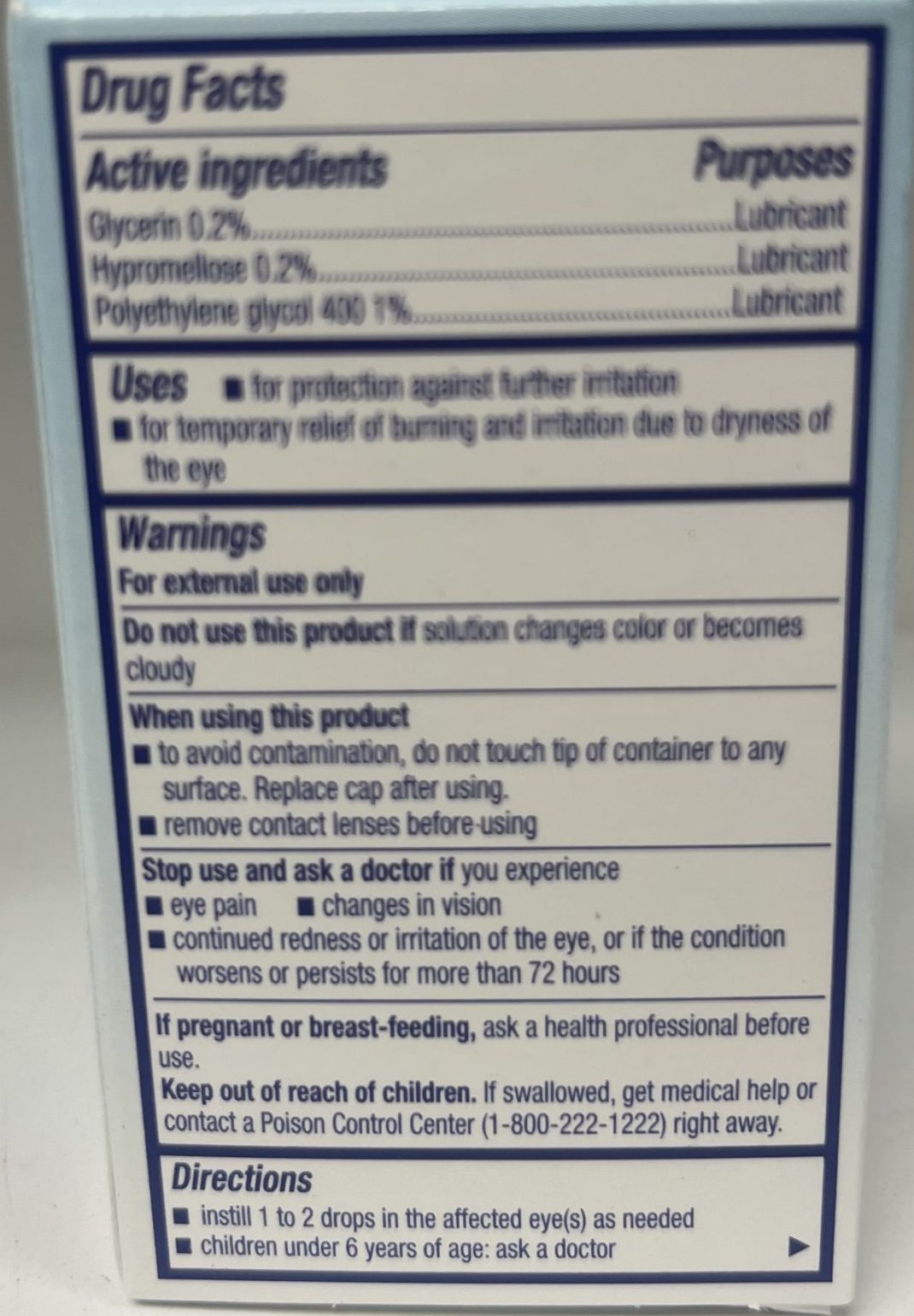 The back of an artificial tears package lists active ingredients, intended uses, warnings, and directions for relieving dryness and irritation in the eyes.