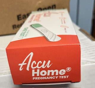 Front corner of an Accu Home Pregnancy Test box showing the logo and part of the test image.