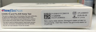 Flowflex Plus COVID-19 and Flu A/B Home Test box side with lot number, expiration date, and manufacturer details.